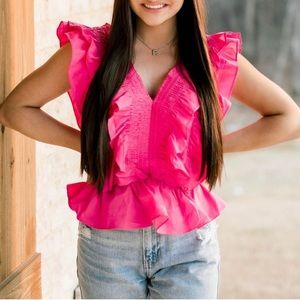 Ruffled top with smocked detail. Fuschia.